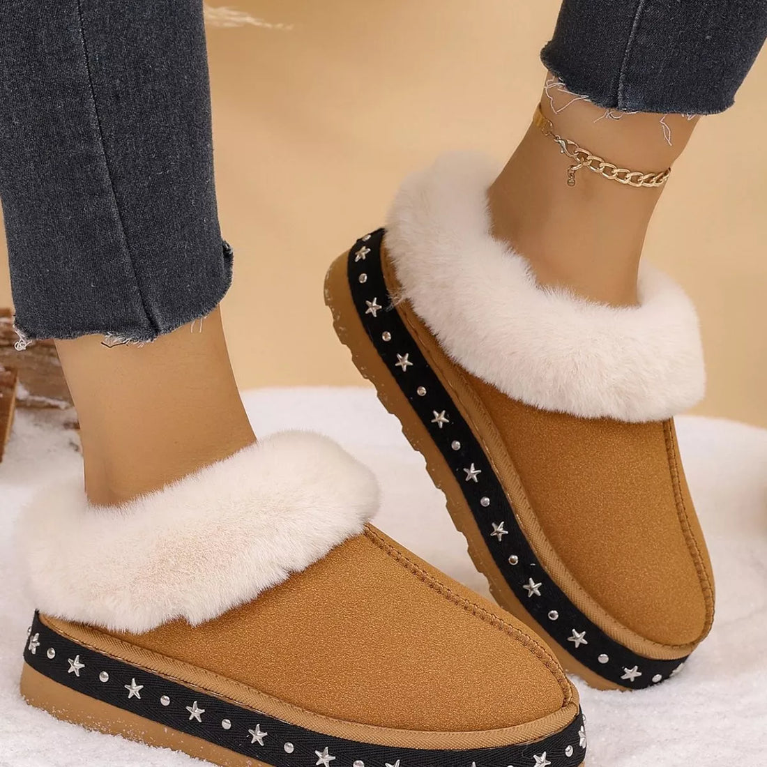 Brown faux fur lined platform ankle boots, two-shoe side view with star trim