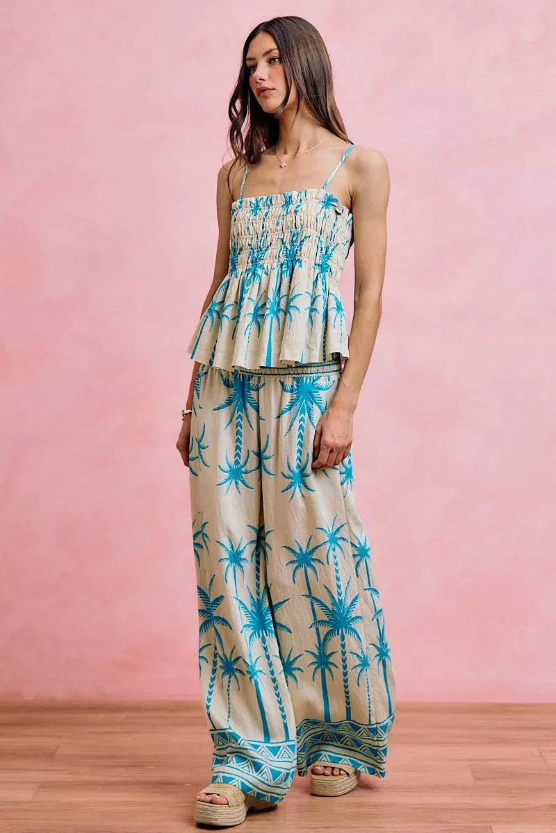 Blue palm tree smocked cami top with adjustable straps and tiered peplum ruffles
