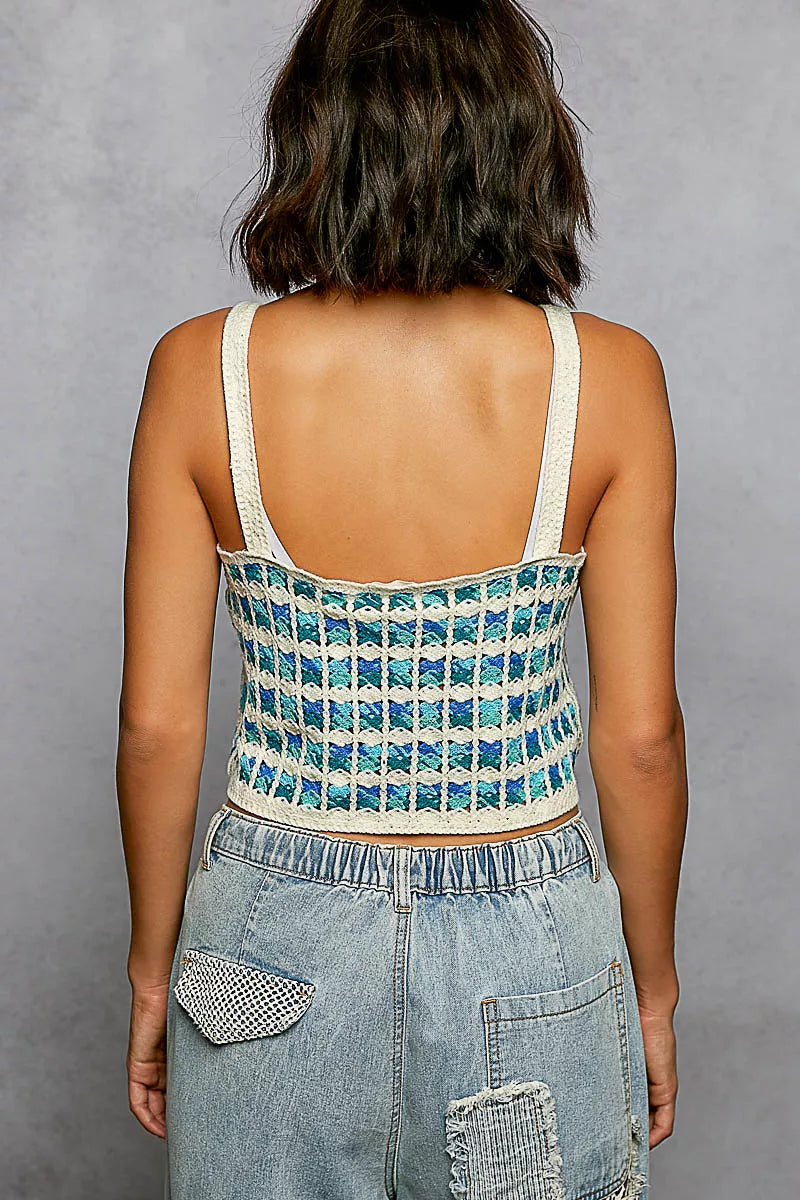 Back view of crocheted cropped cami with scalloped edge, thin white straps