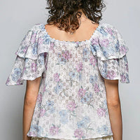 Back view floral ruffle short-sleeve blouse with lace-trim neckline, off-white pastel print