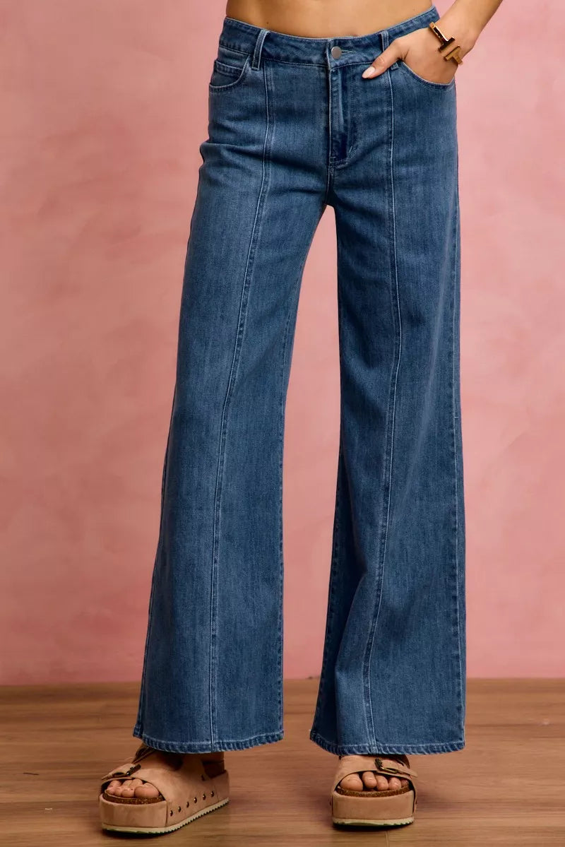 Mid-rise stretch denim jeans with wide flared legs, front center seam detail