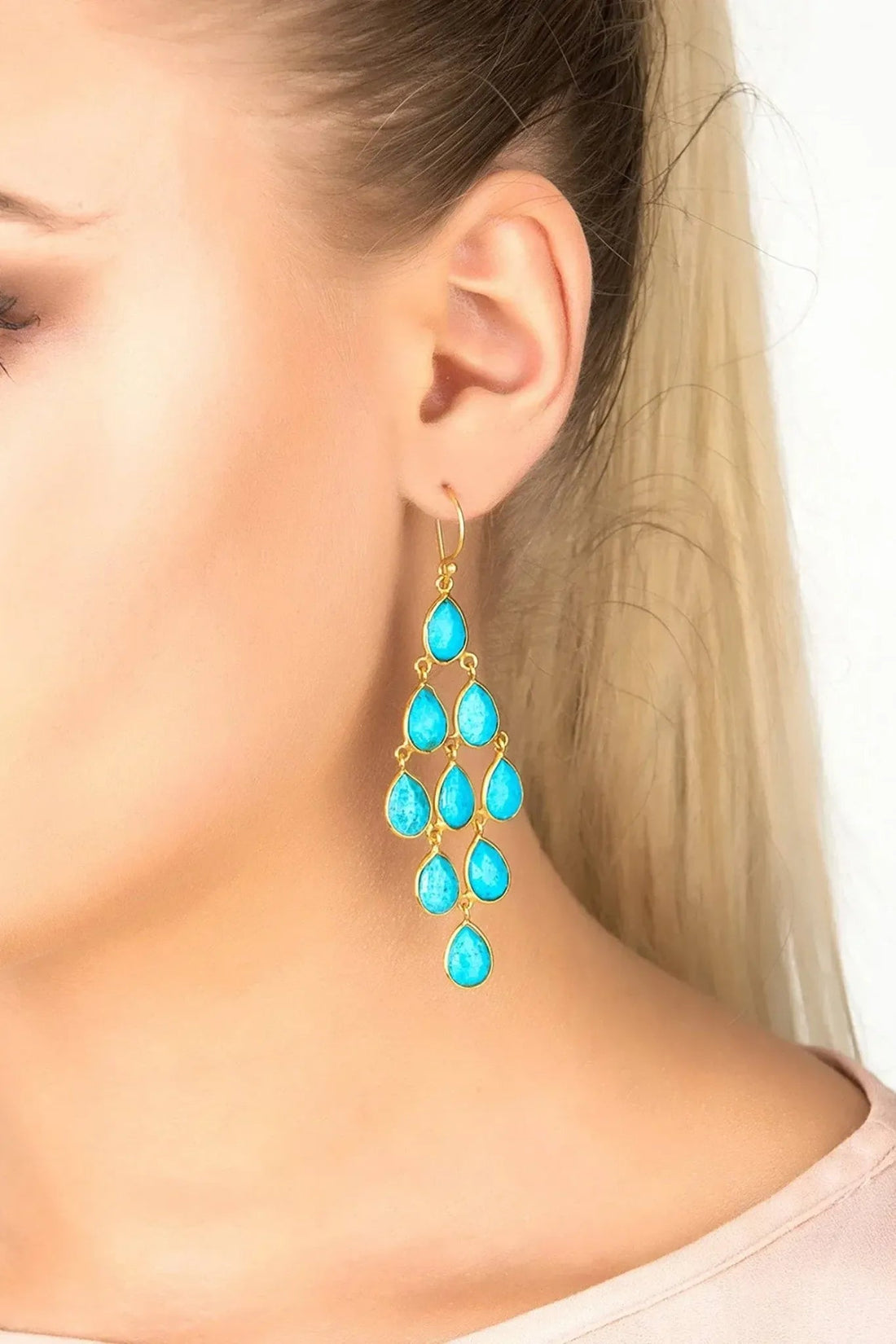 Gold-tone turquoise teardrop drop earrings with dangling cascade