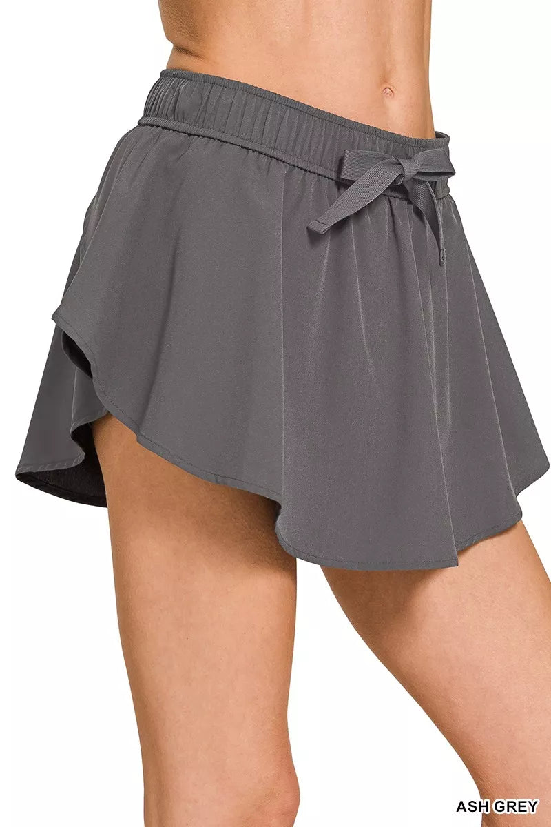 Ash grey woven active skort, elastic waist with draped skirt and bow tie