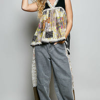 Black sheer floral V-neck tank with lace trim and patchwork paneling