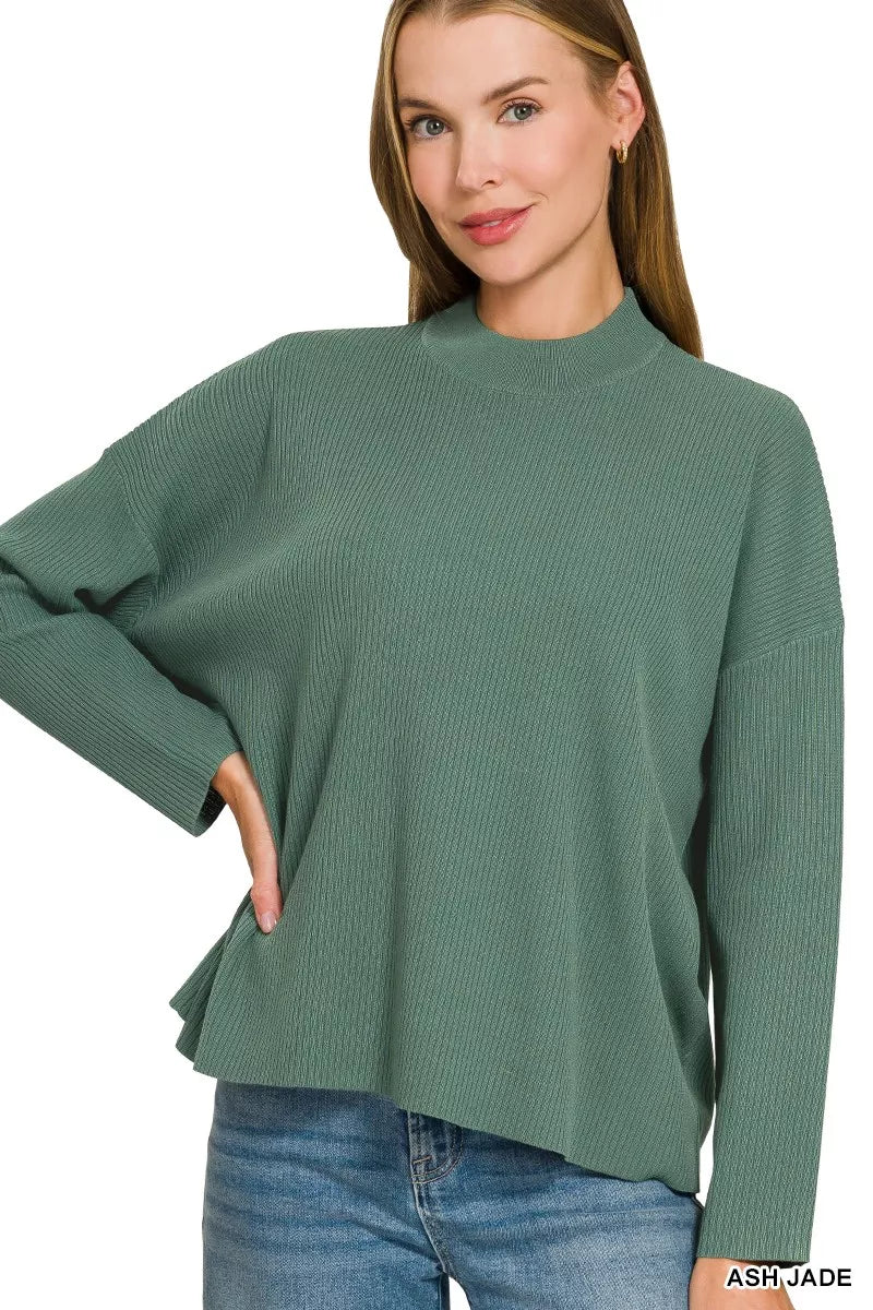 Teal-green crew-neck sweater top with long sleeves and slightly flared hem