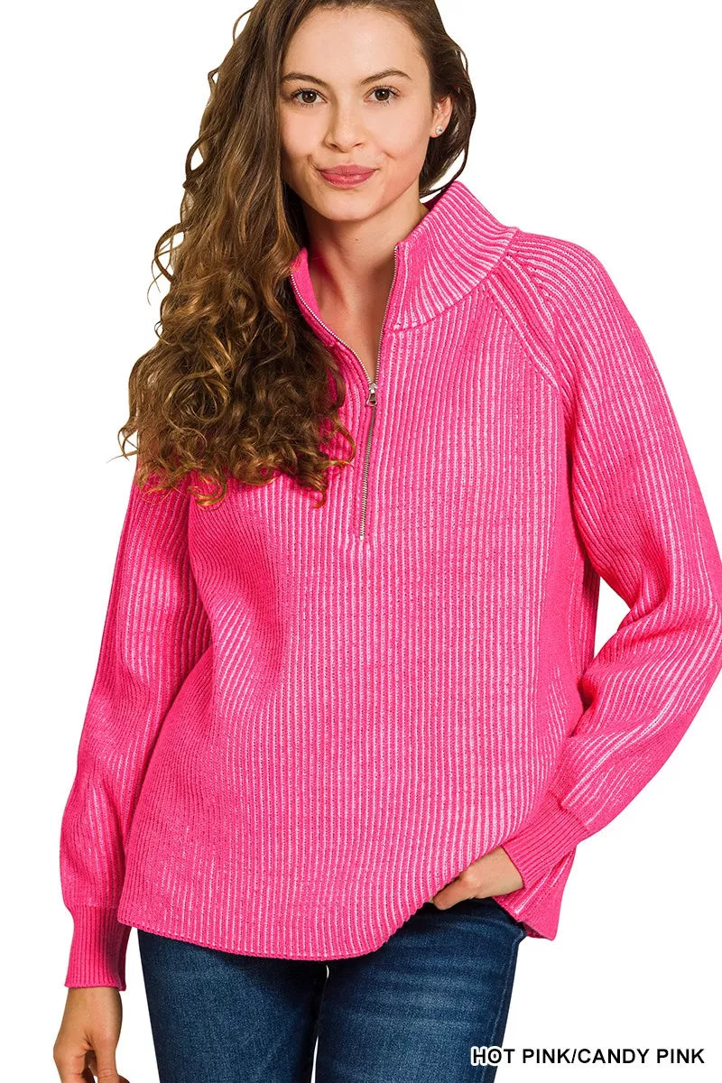 Hot pink ribbed half-zip sweater with tall collar and long sleeves