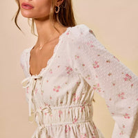 White floral clip-dot lace-trim peplum blouse with tie-front drawstring and puff sleeves