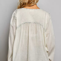 Back view pale grey embroidered button-front woven shirt with gathered yoke