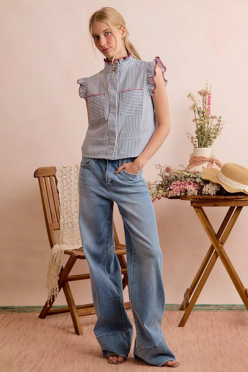 Striped sleeveless vest top with ruffled shoulders and red-trim details, front view