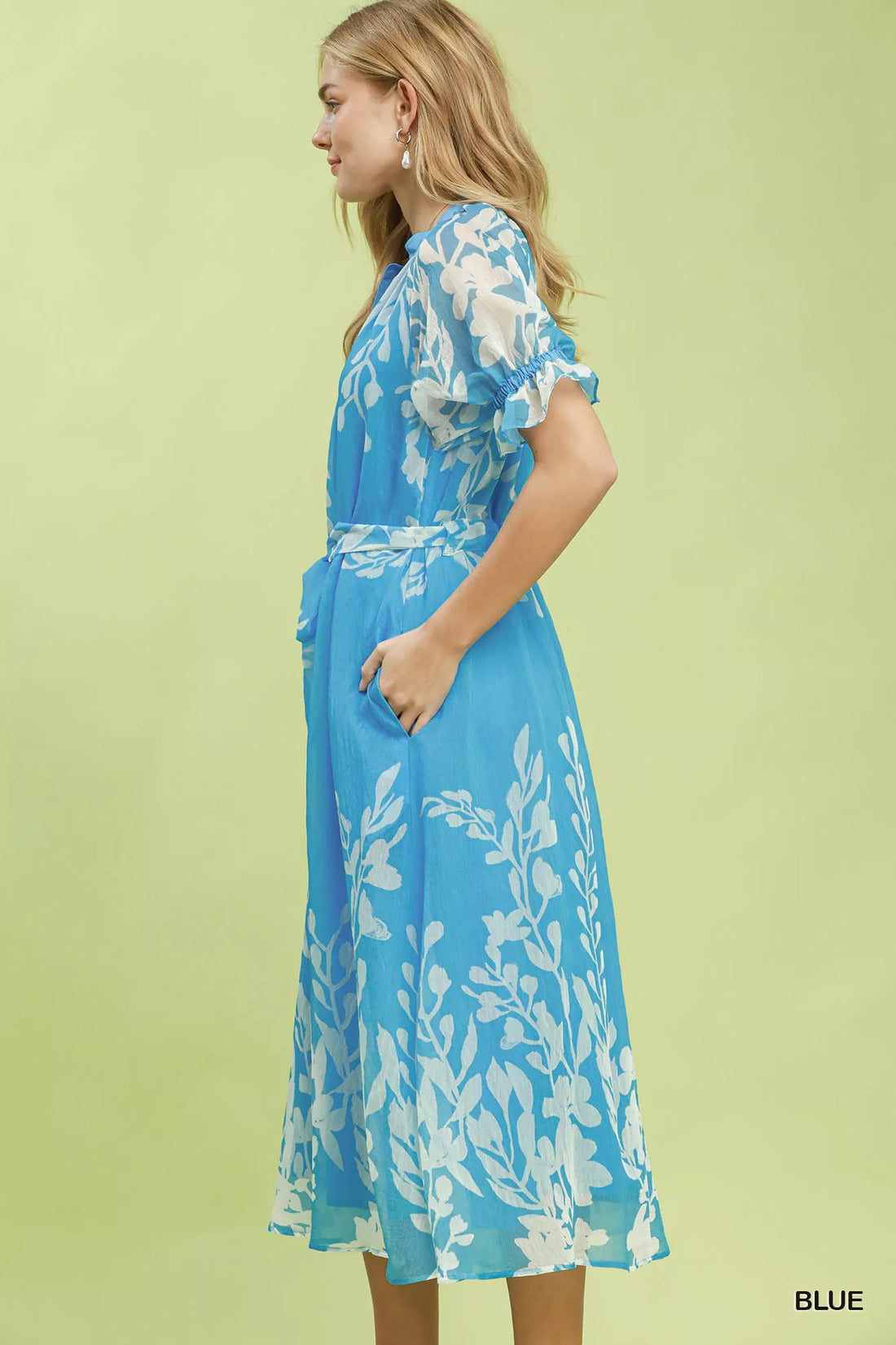 Blue floral tie-waist midi dress with short ruffled sleeves, side profile view