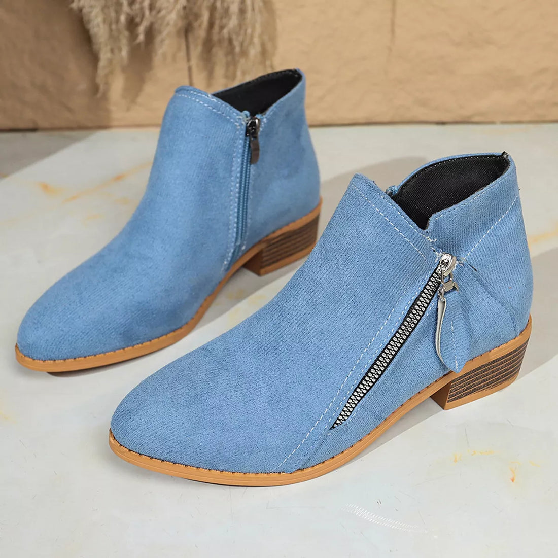 Sky blue point-toe block heel ankle boots with side zipper and dark lining