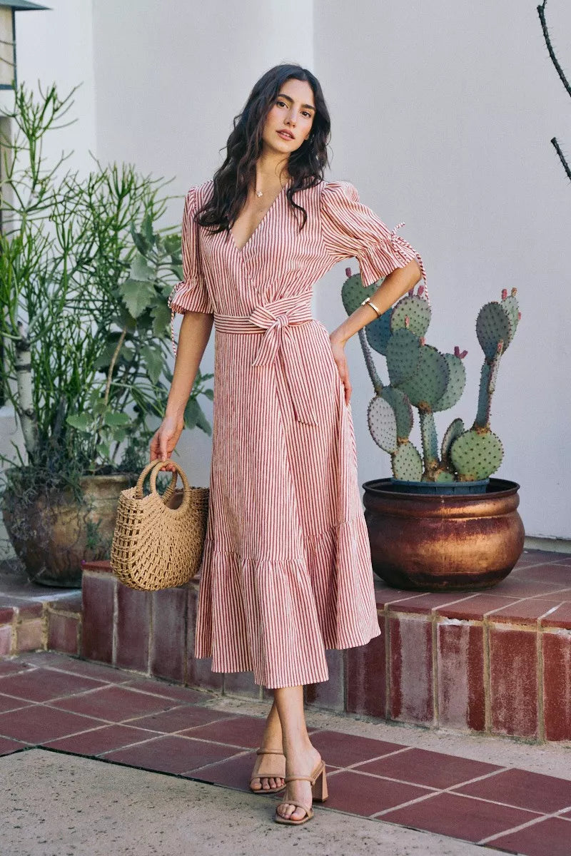 Red-and-white striped wrap midi dress with V-neck, tied waist, short puff sleeves