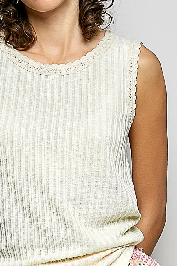 Close-up: beige ribbed sleeveless tank with scalloped lace round neckline