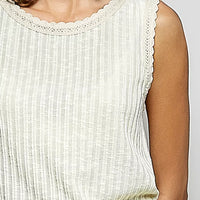 Close-up: beige ribbed sleeveless tank with scalloped lace round neckline