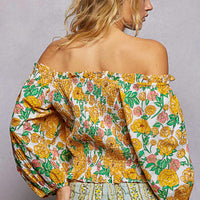 Floral off-shoulder smocked blouse with gathered back yoke and long puff sleeves