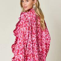 Hot pink printed plus size blouse, back view with gathered ruffle-trim sleeves