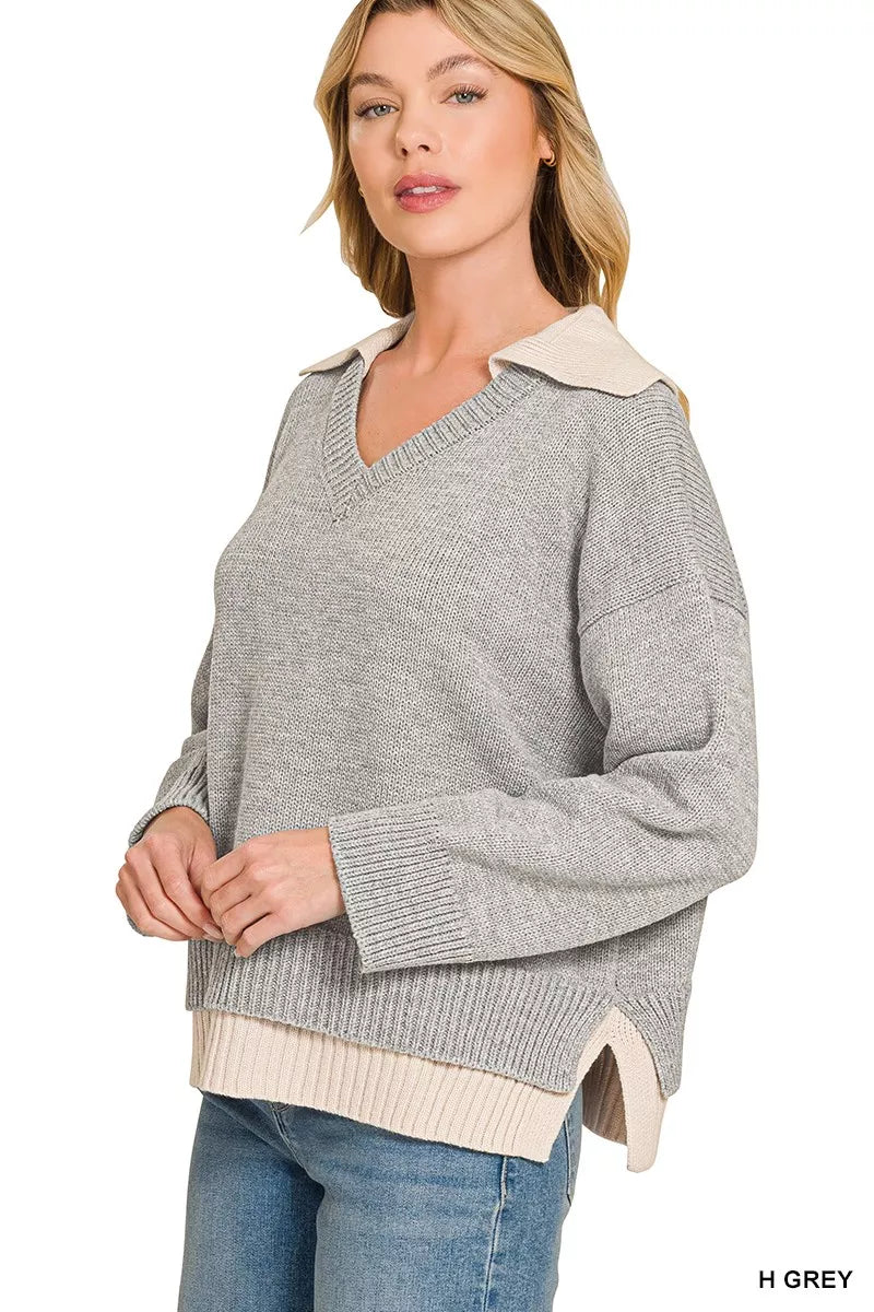 Grey V-neck sweater with knit collar detail and ribbed cuffs, dual-look hem overlay