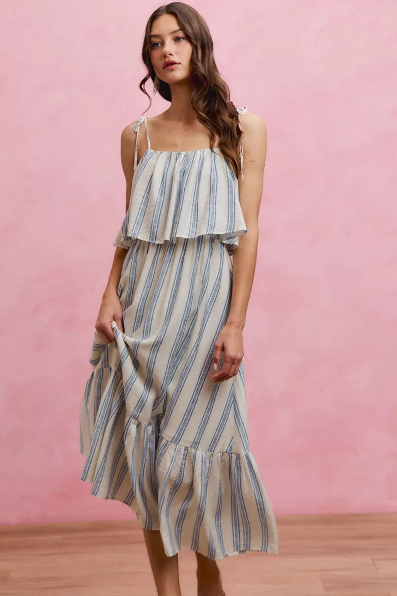 Sleeveless striped tiered midi dress with tie shoulder straps and blue-and-white vertical stripes