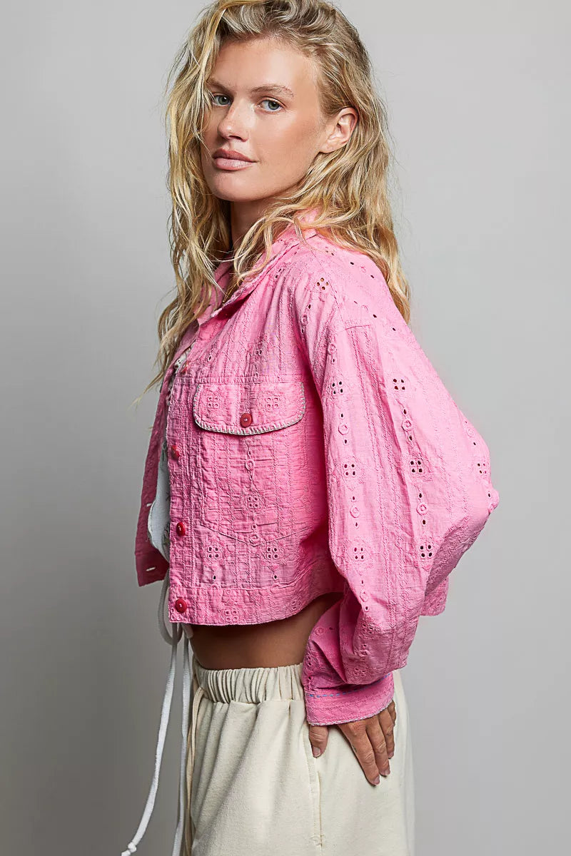 Candy pink eyelet-textured cropped jacket with button front, long sleeves, flap pockets