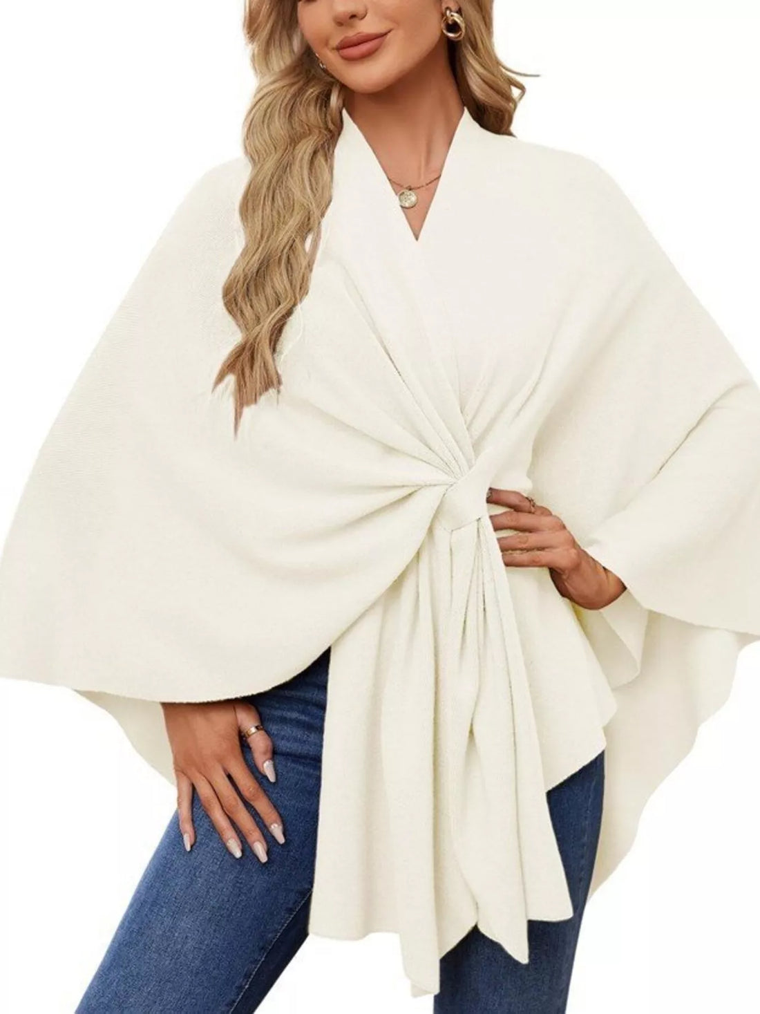 Ivory shawl cape with front tie and wide drape sleeves, worn with jeans