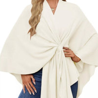 Ivory shawl cape with front tie and wide drape sleeves, worn with jeans
