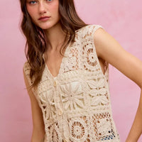 Natural crochet sleeveless vest top with V-neck and button front, scalloped lace pattern