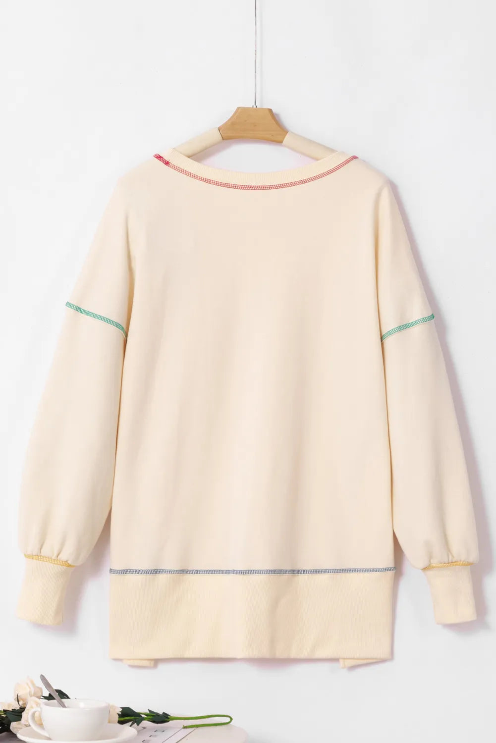 Ivory long-sleeve sweatshirt, back view, with contrast stitched hem and cuffs