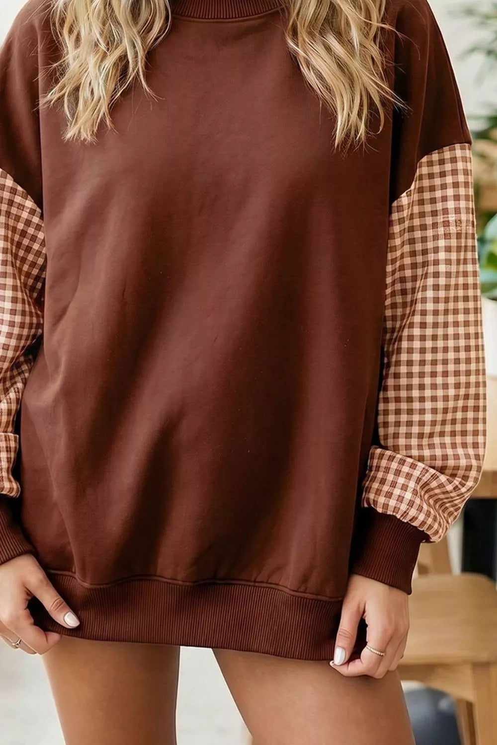 Dark brown loose tunic sweatshirt with plaid check long sleeves and ribbed cuffs