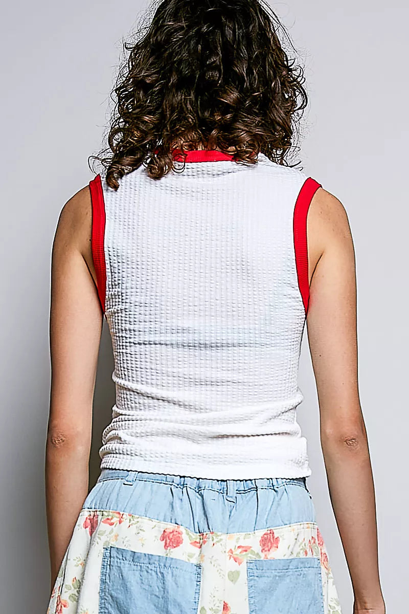 Back view of off-white ribbed sleeveless tank with red contrast trim around neck