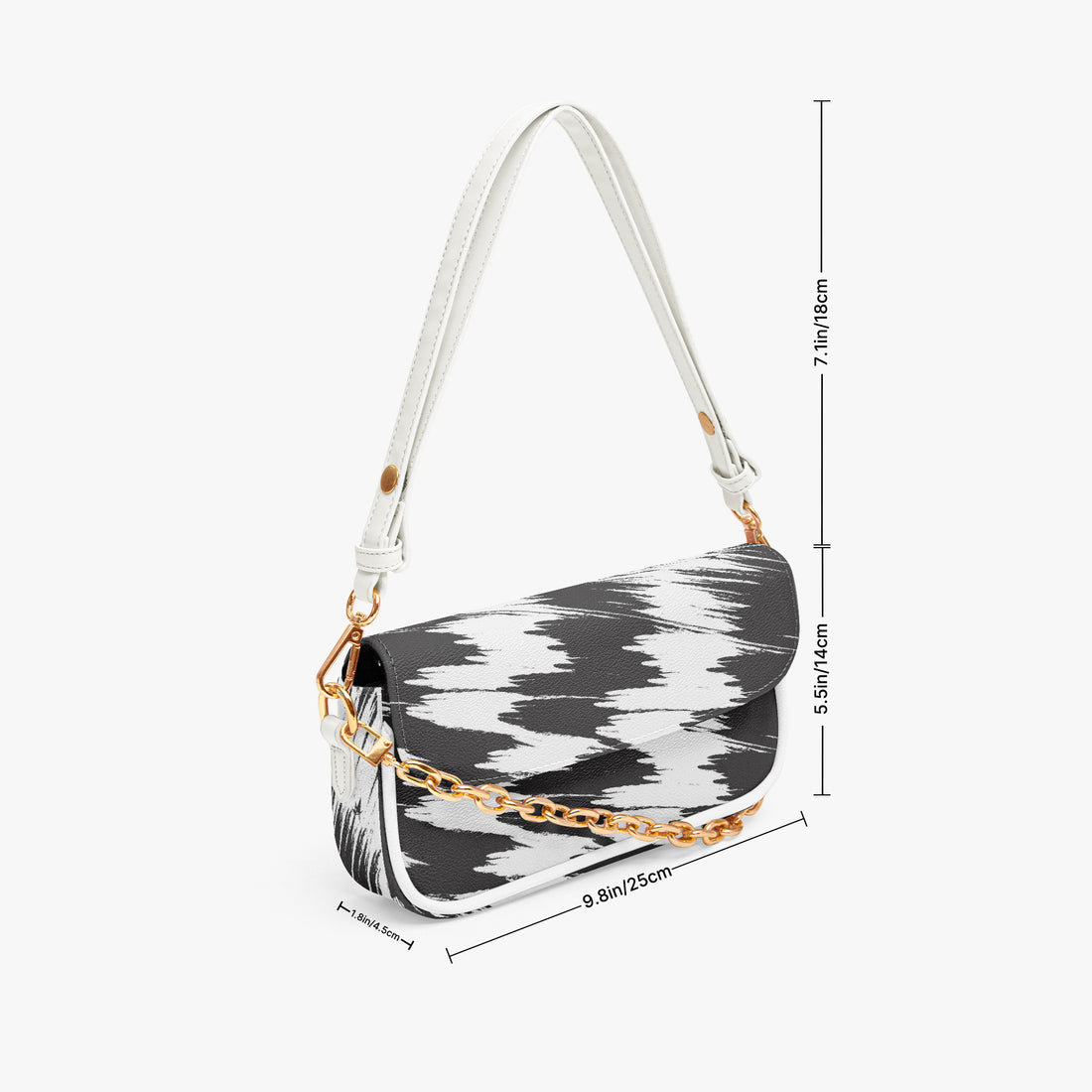 Black and white cowprint half-moon shoulder bag with white strap and gold chain
