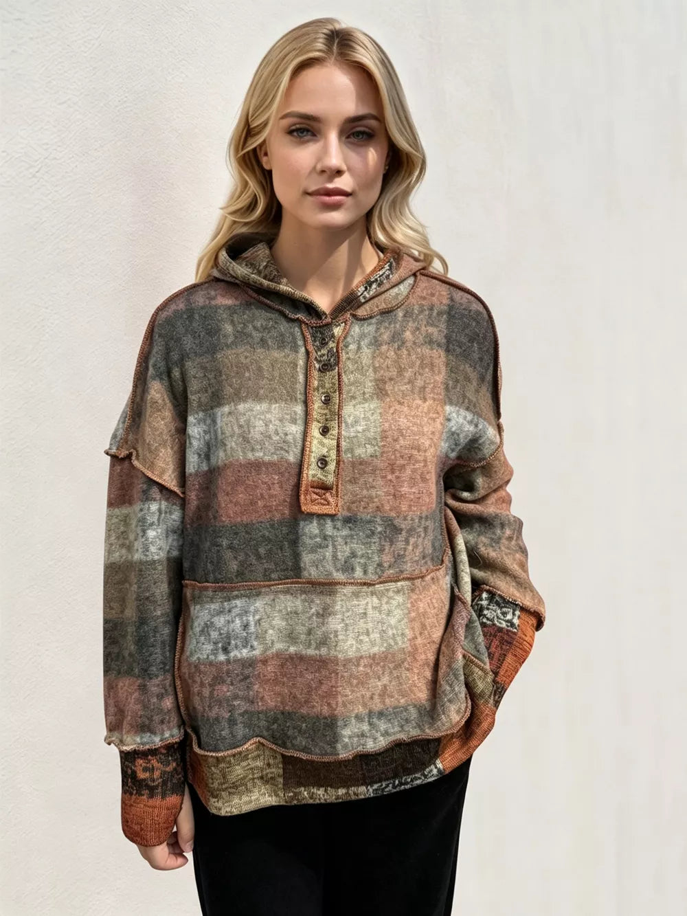 Plaid fleece hoodie with dropped shoulders, front half-zip, kangaroo pocket, front view.