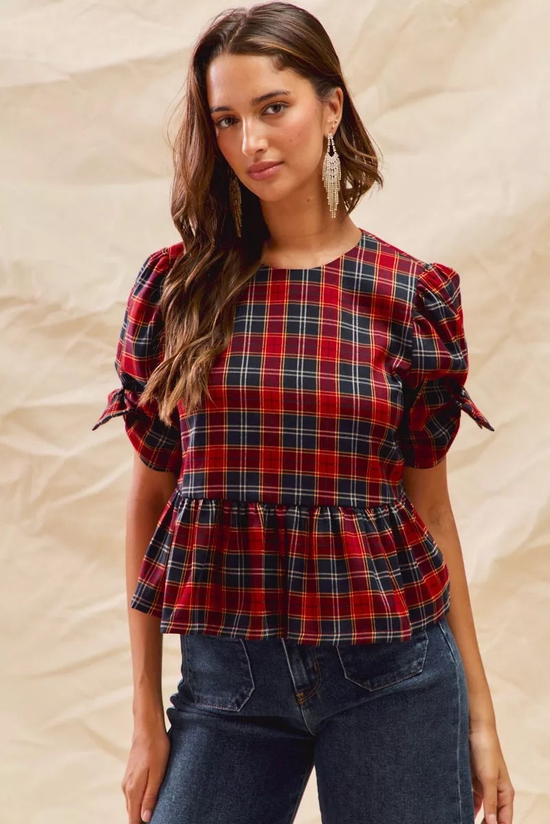 Red plaid peplum top with ribbon-tied short puff sleeves