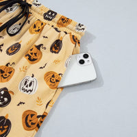 Gold Halloween pumpkin print lounge shorts, elastic waist with side ruffle detail