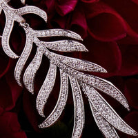 Silver feathered leaf drop earring with pavé stones