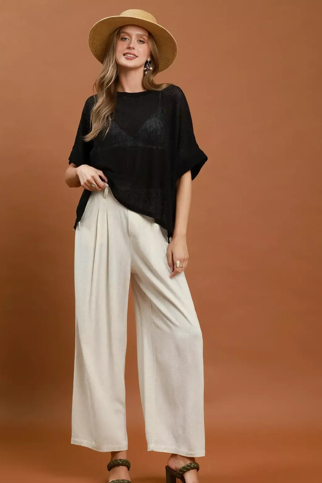 Cream high-waist wide-leg trousers with pleated front and ankle-length wide legs