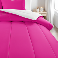 Hot pink comforter with stitched panel seams and rounded channel lines