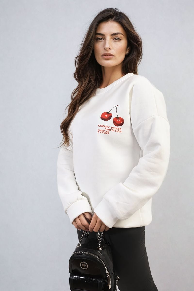 White oversized knitted jumper with small cherry front graphic and long sleeves