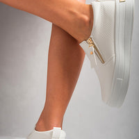 White slip-on trainers with elastic gore and side zipper detail, gold-tone hardware