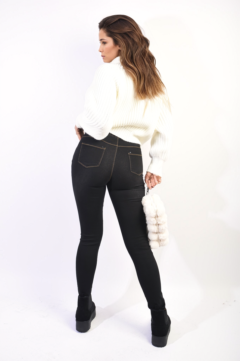 Black high-waisted skinny jeggings with knee rips and faded distressed details