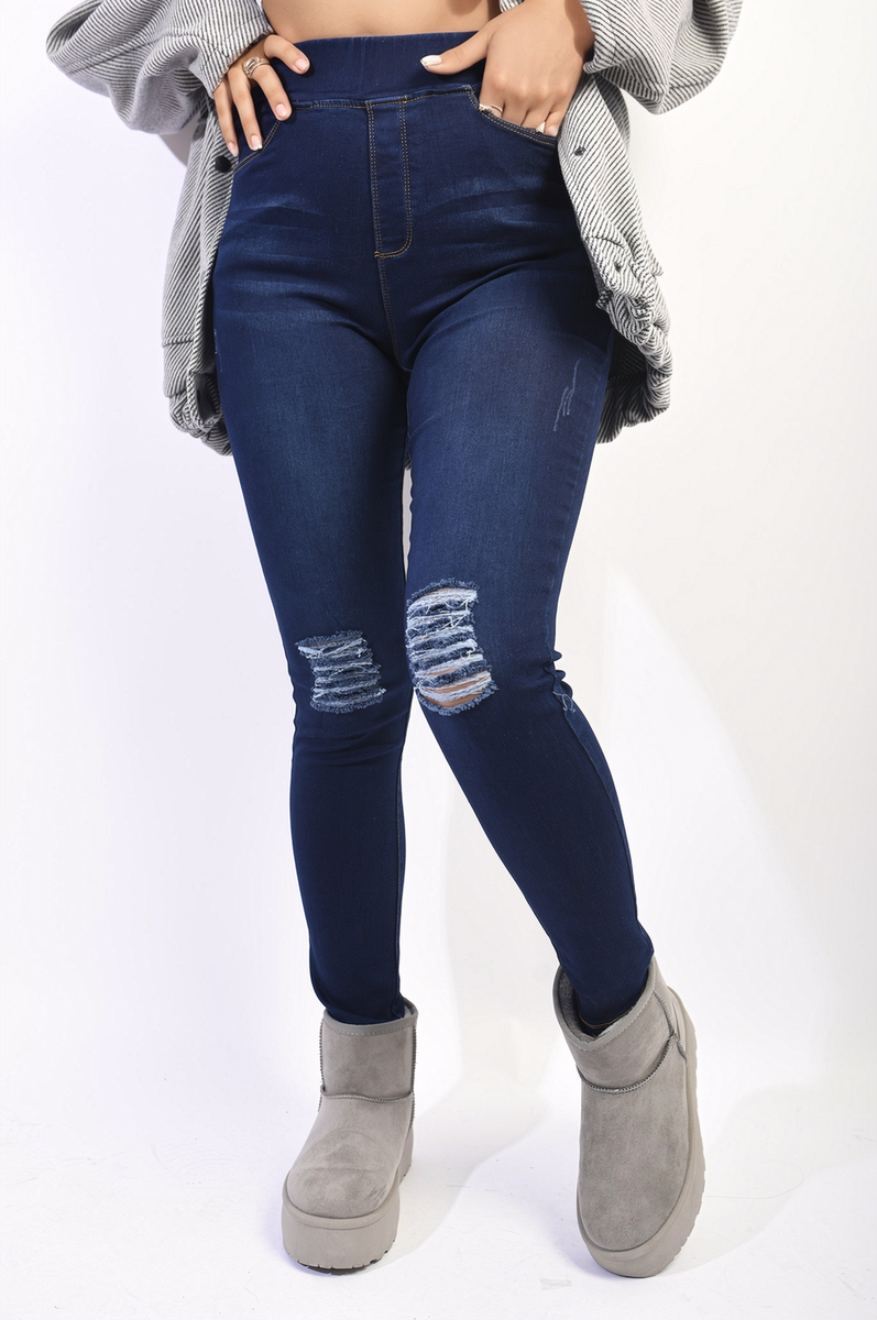 Dark blue high-waisted skinny jeggings with distressed knee rips and light fading