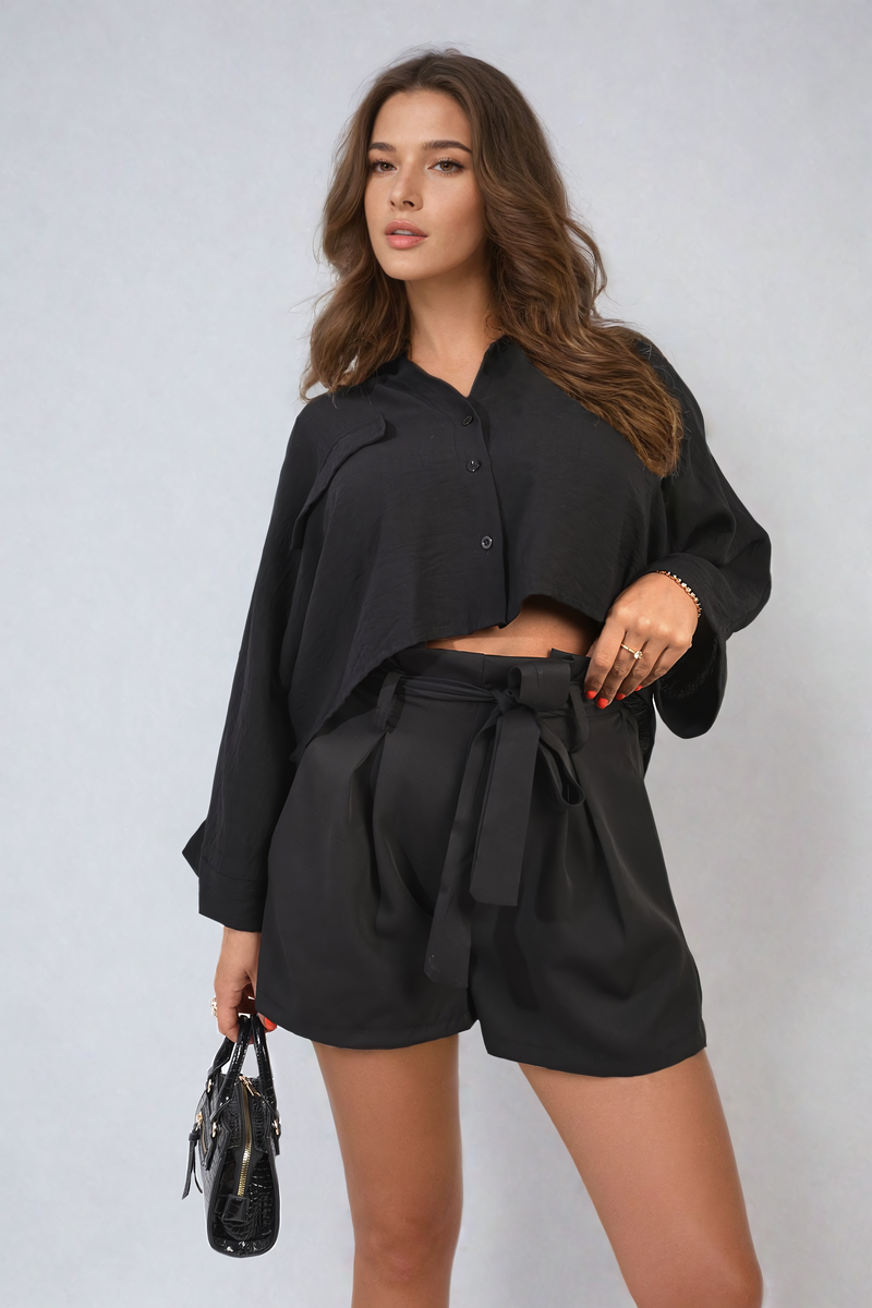 Black paper bag high-waist shorts with button front and tie belt at waist