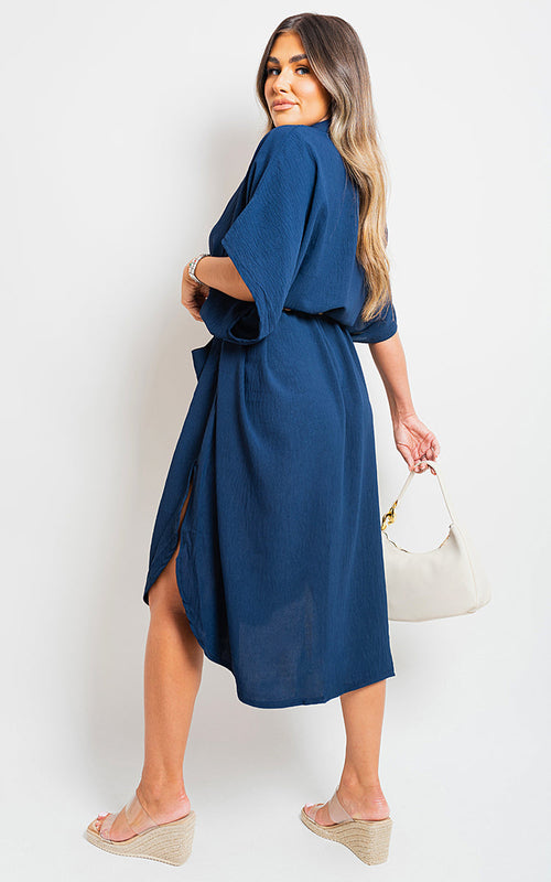 Navy button-down collared midi dress with two front pockets and belt tie
