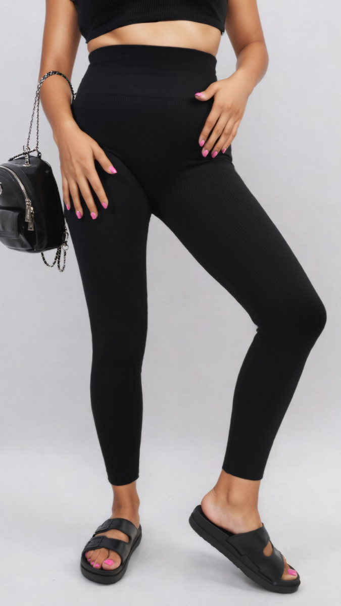 Black high-waisted ankle leggings with wide waistband, ribbed leg texture.