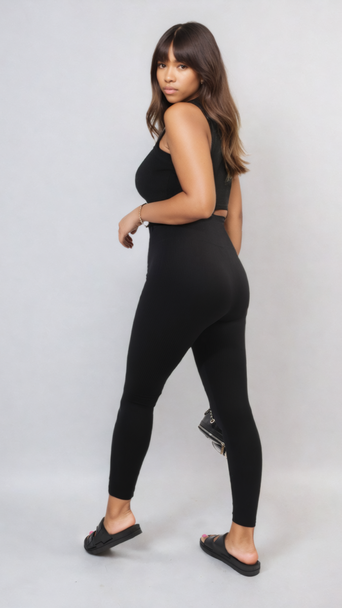 Black high-waisted ankle leggings with wide waistband, side view full length.