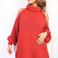 Red high-neck oversized knit jumper with cold-shoulder cutouts and studded trim