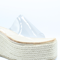 Beige platform wedge sandal with clear toe strap and textured braided midsole