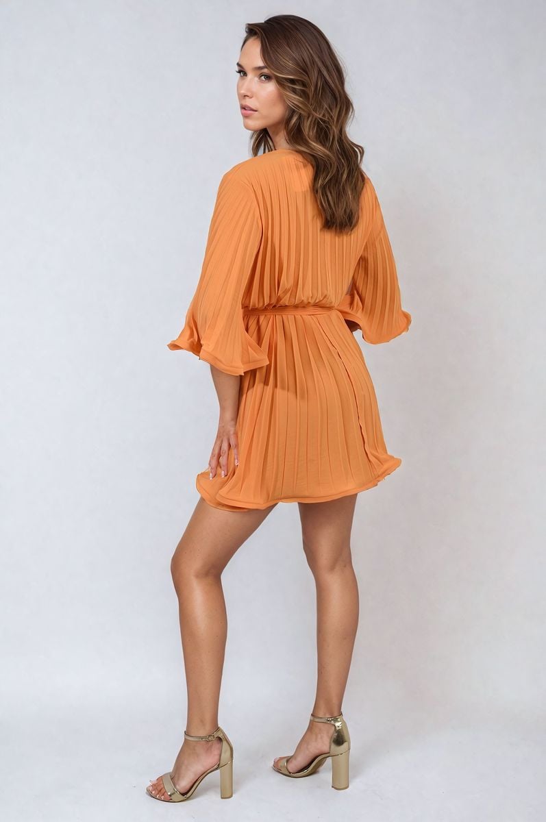 Orange pleated mini dress with tie waist and wide sleeves, gathered skirt.