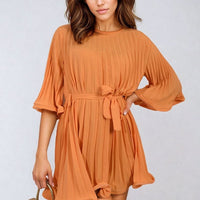 Orange pleated mini dress with tie waist and wide elbow-length sleeves