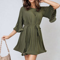 Olive green pleated mini dress with tie waist and wide sleeves, loose gathered skirt.
