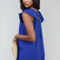 Royal blue wide-leg jumpsuit with V-neck and tied back strap detail